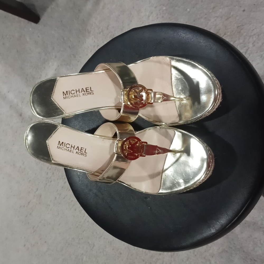 Gold Michael Kors thong wedges.